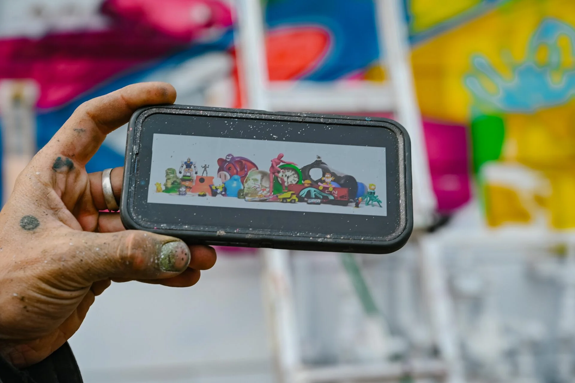 close up of a photo on a phone, the inspiration for one of the murals