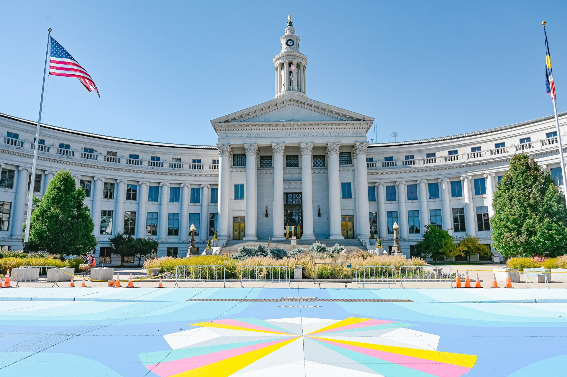 denver city hall with a large colourful mural on the roadway out front