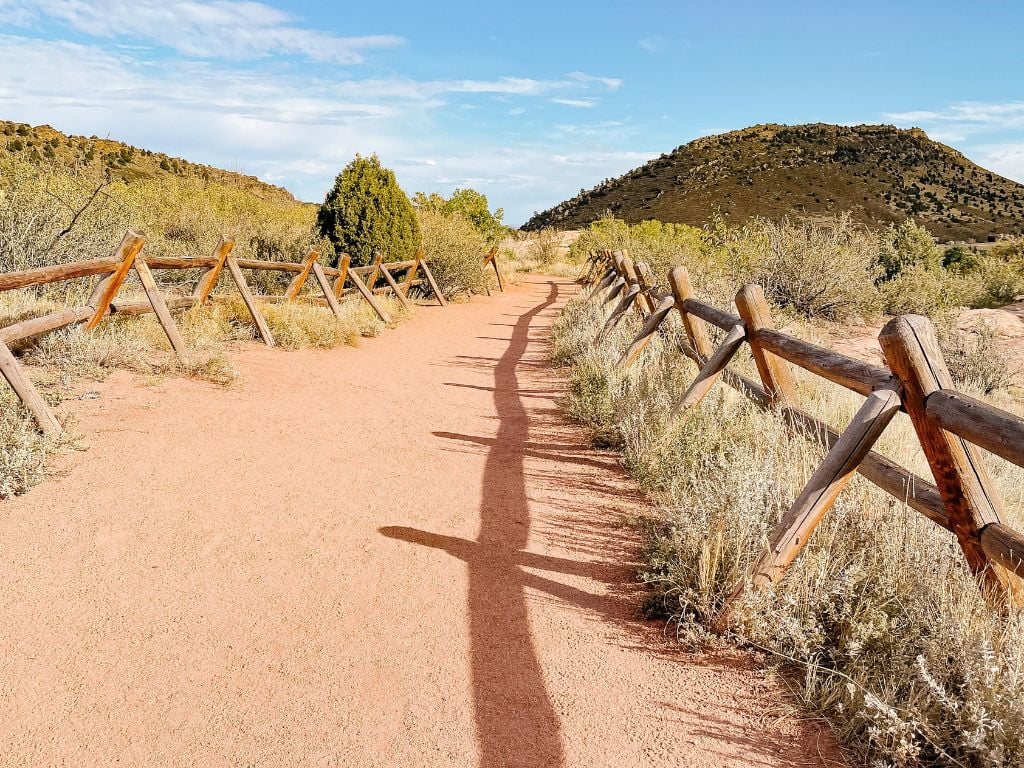 hiking path that winds through red rocks park on a northern colorado road trip