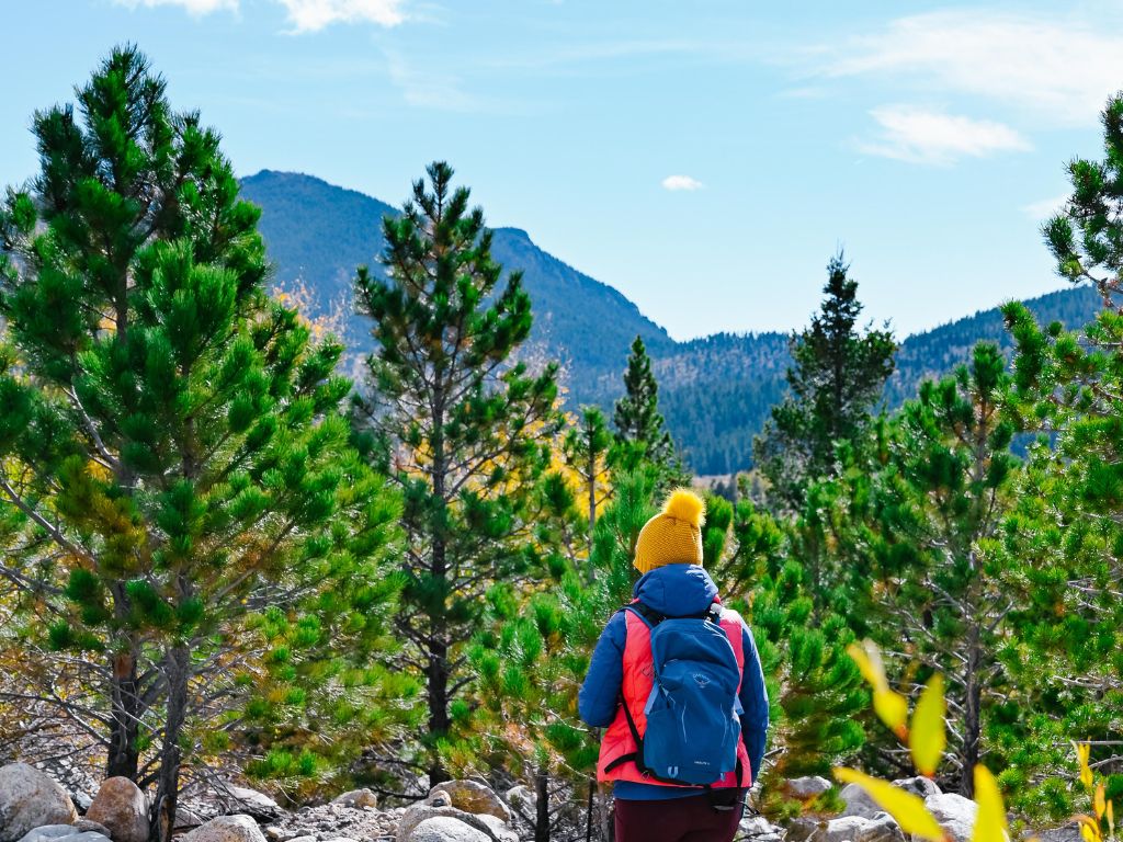 woman hiking inside rocky mountain national park