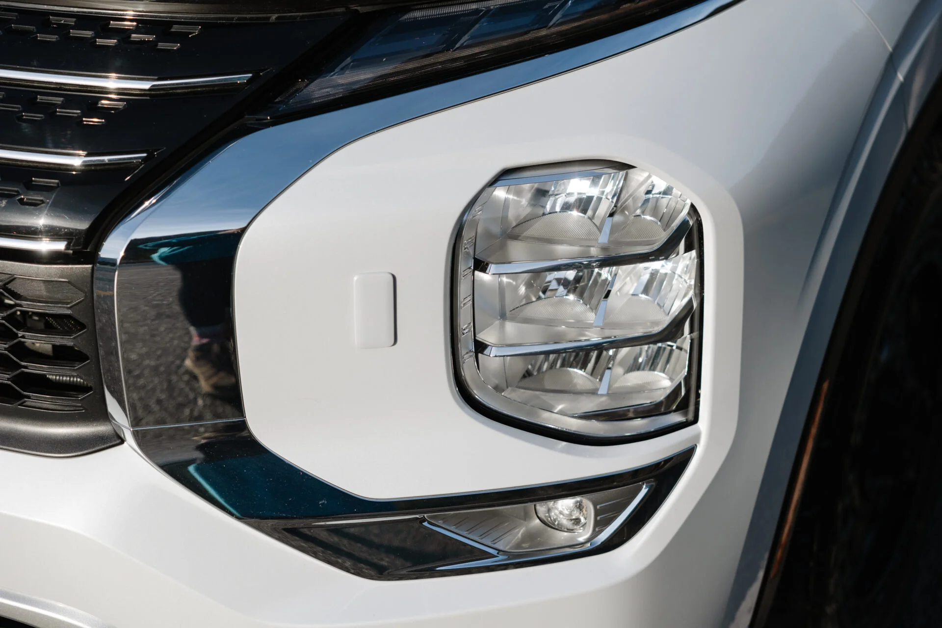 a close up photo of the headlight on a mitsubishi outlander phev