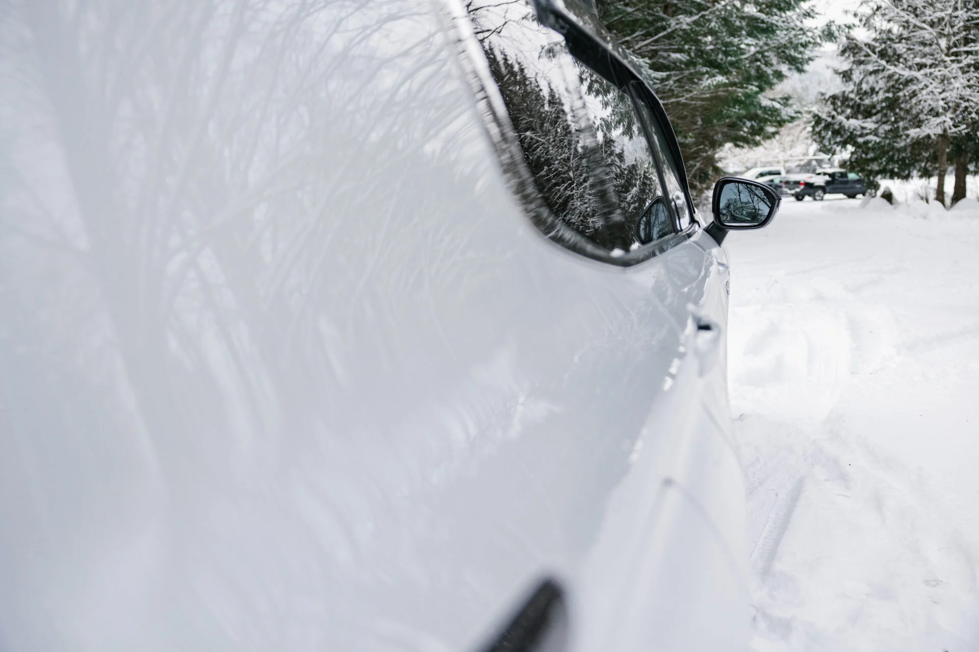 close up view along the side of a white vehicle