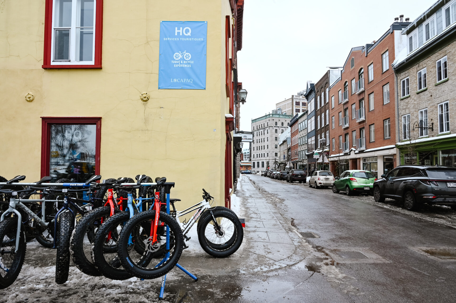 traditional fat bikes sit outside the tuque & bicycle experiences storefront in old quebec city