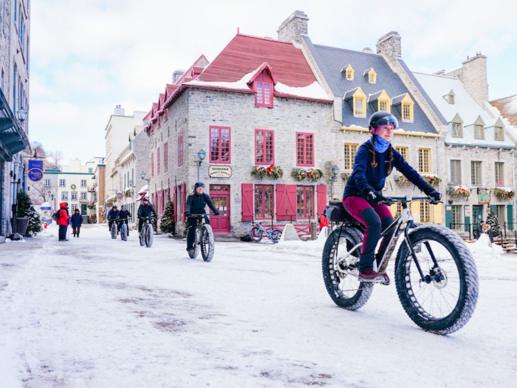 a group bike tour rides through old quebec city
