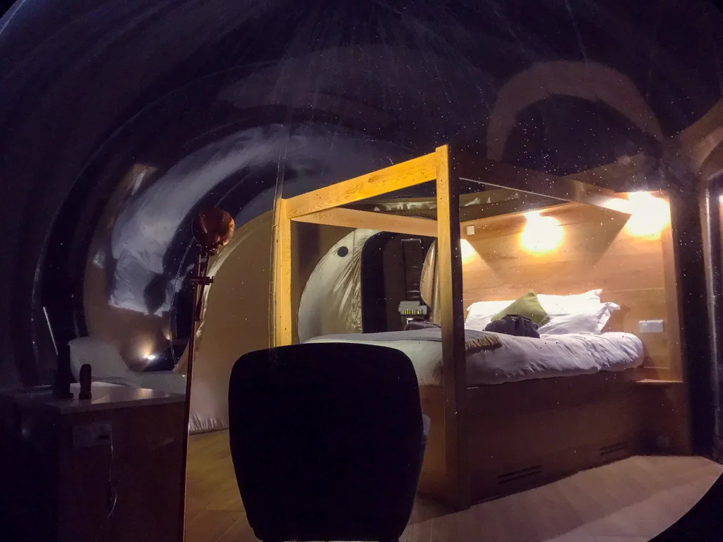 nighttime view looking inside a Finn Lough bubble dome from the outside