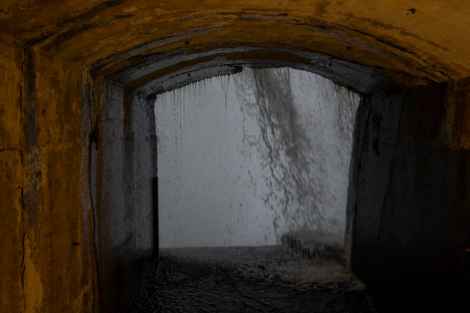 one of the lookout points at the journey behind the falls attraction, the water rushes past