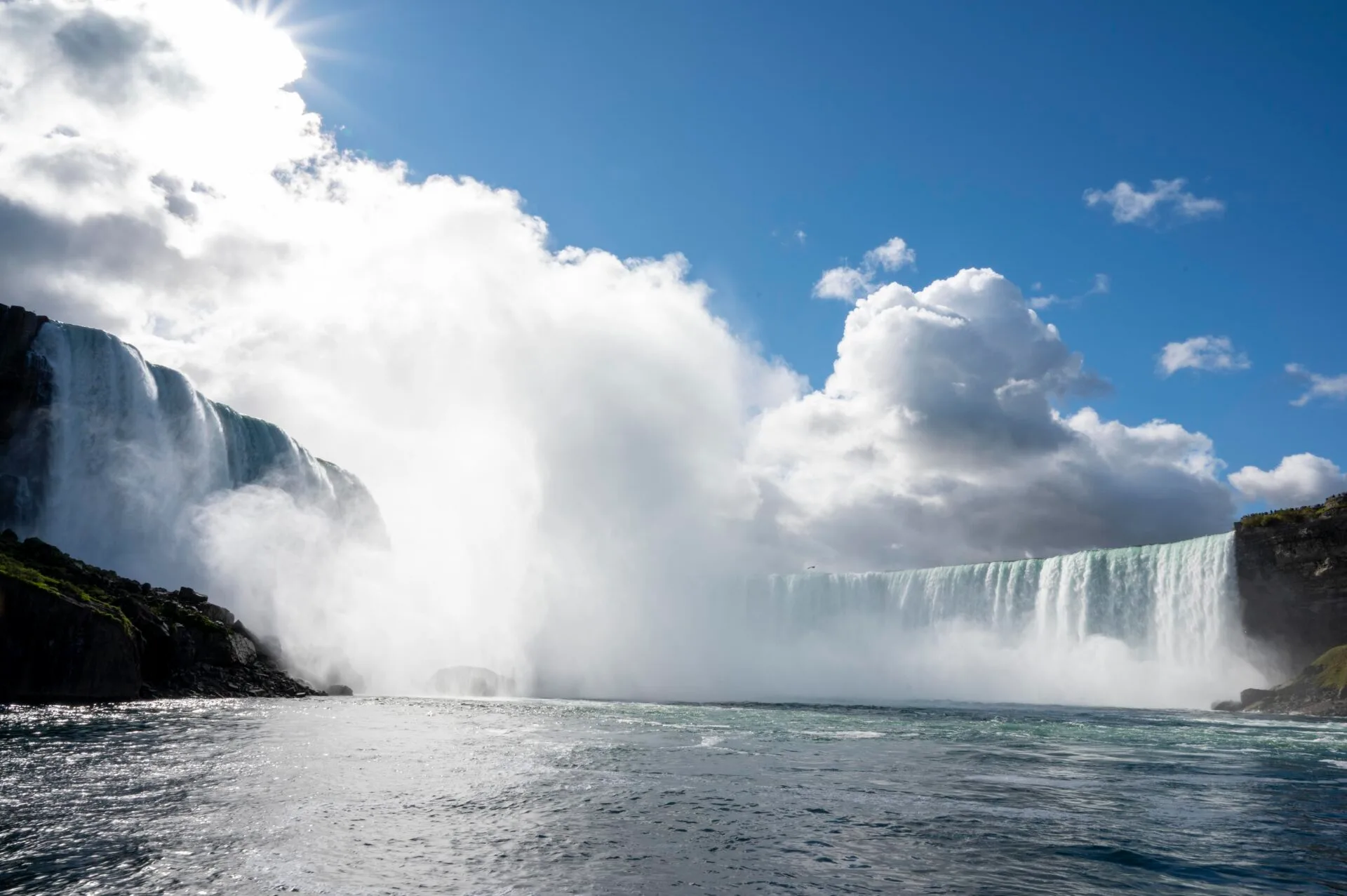 close up of niagara falls from the front of a boat