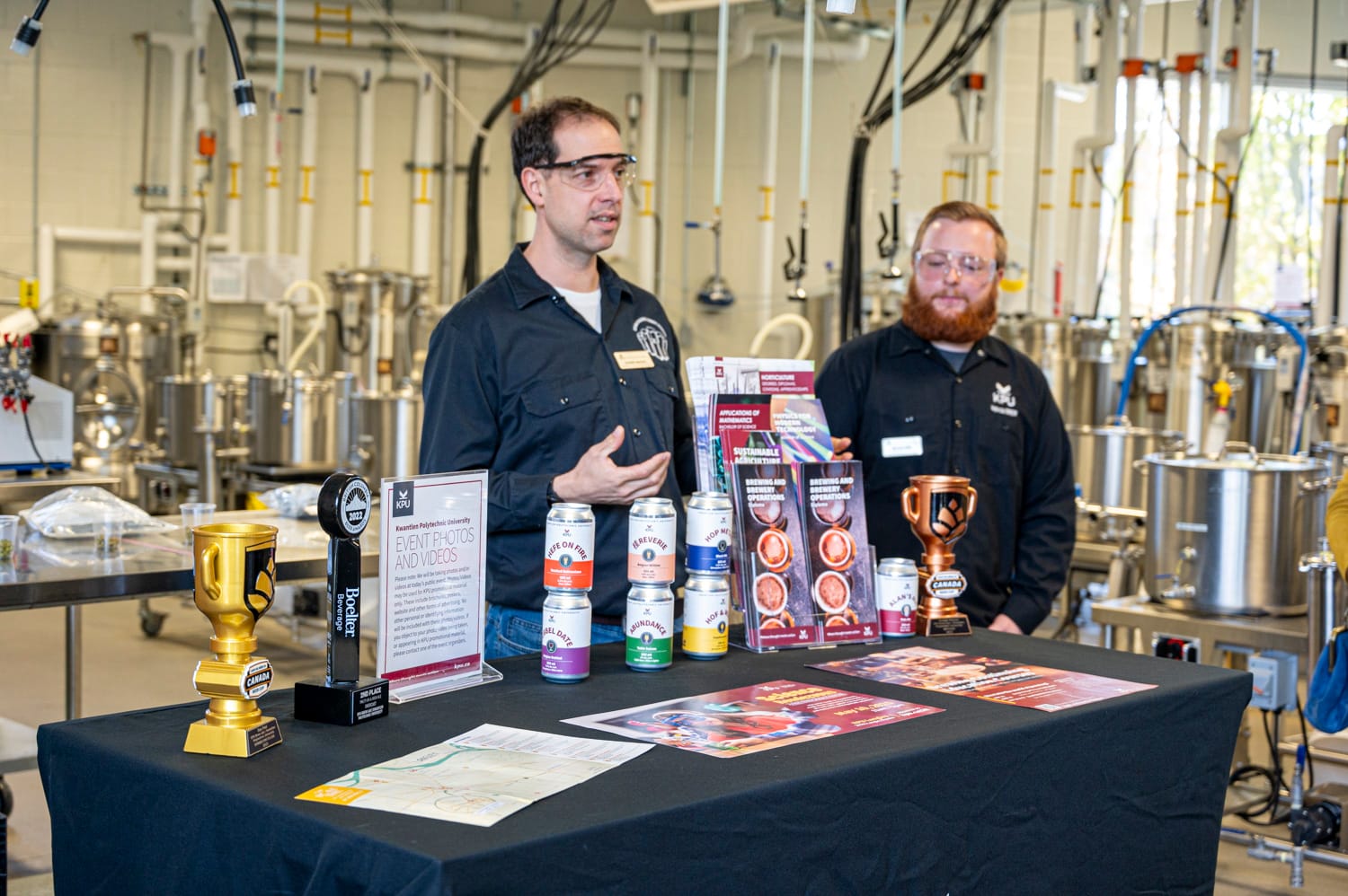 two instructors at the KPU brew lab are speaking to a group of people about the program