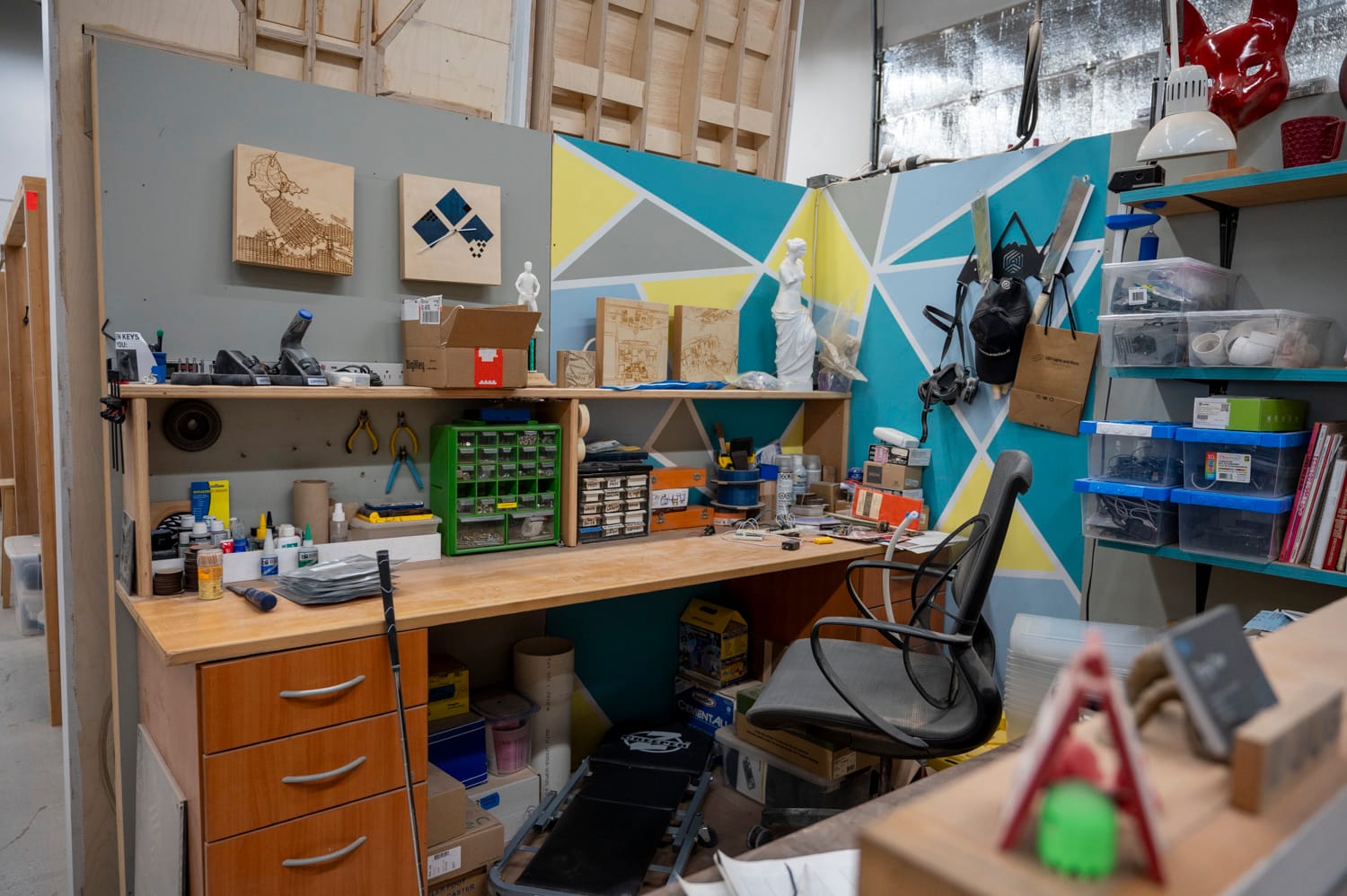 a workspace cubicle inside maker cube in langley city