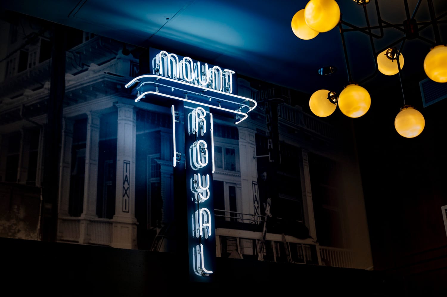 front entrance neon sign of the mount royal hotel in banff