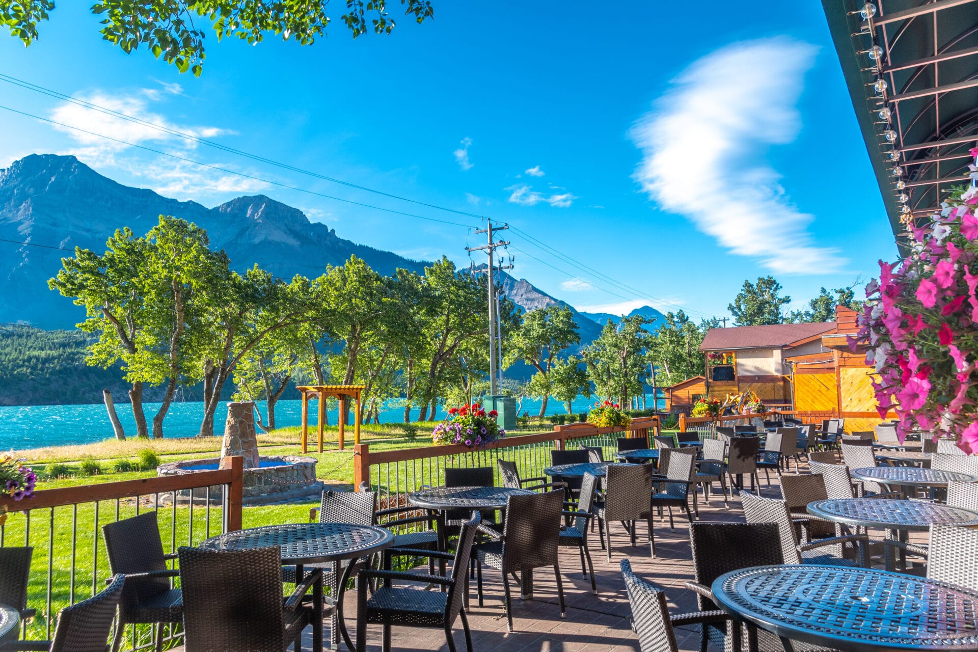 view from the patio at bayshore inn and spa overlooking the mountains and waterton lake