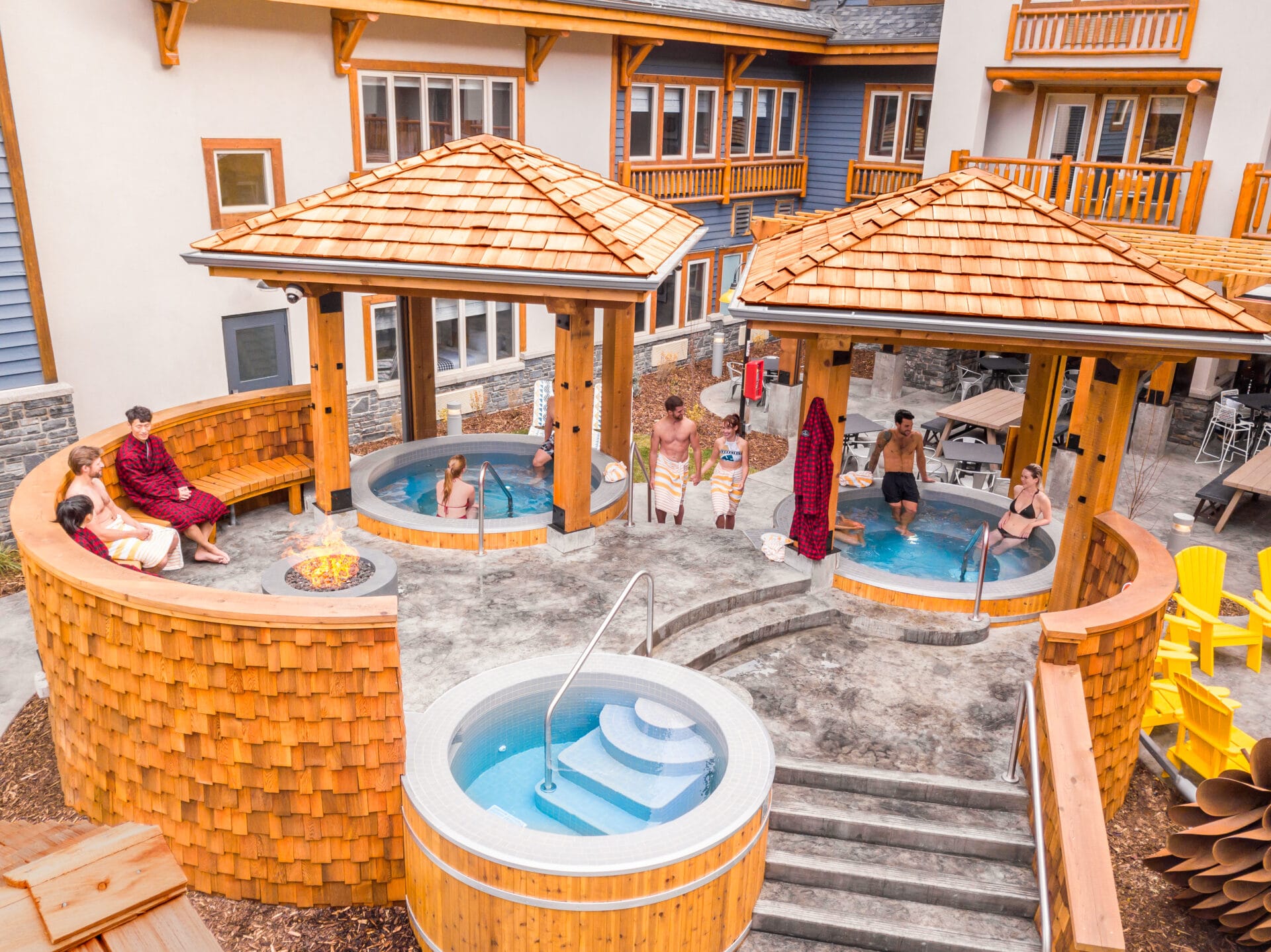 people soaking in the hot tubs at the canalta lodge, one of the many Family Reunion Venues In Alberta