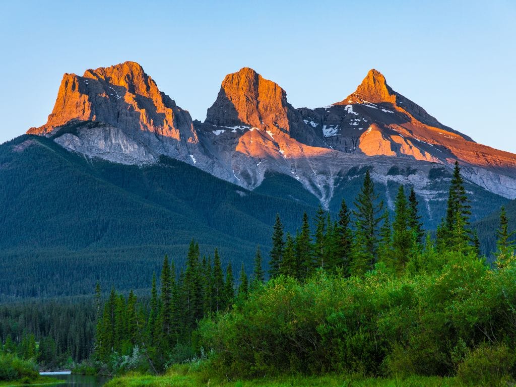 view of the three sisters mountain range from kananaskis alberta