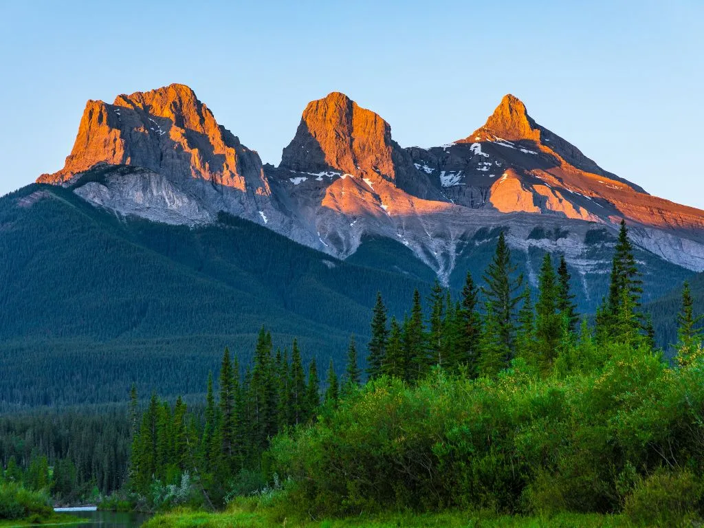 view of the three sisters mountain range from kananaskis alberta