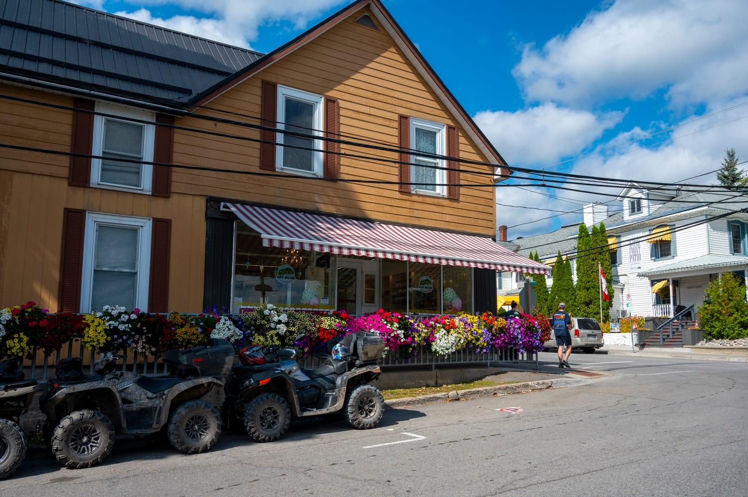 shop that is lined with bright flower beds in westport ontario