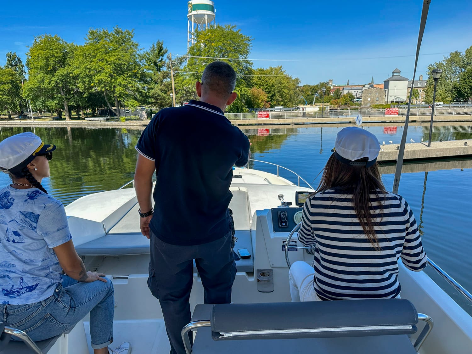 two captains getting their captains training from a le boat staff member