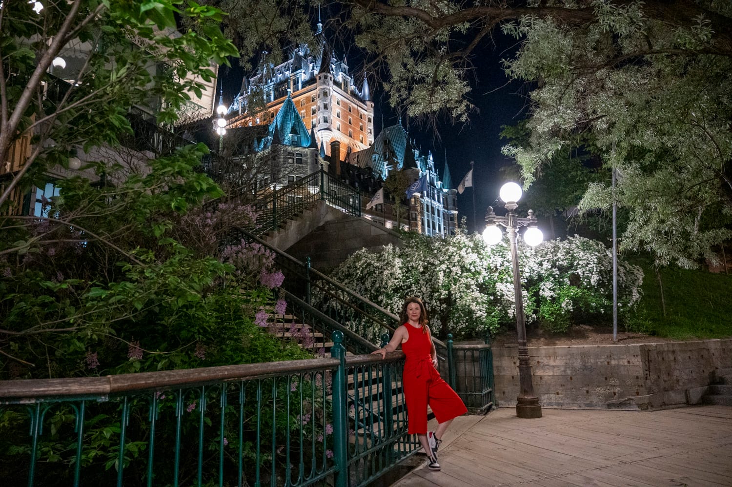 woman wearing a red jumper Poses on the Frontenac Stairs
