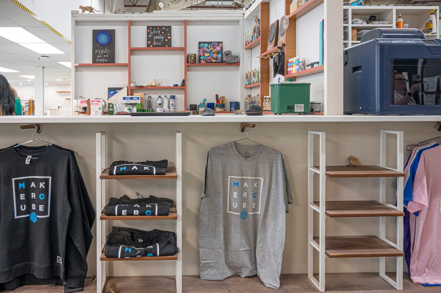 langley maker cube merchandise hangs in front of a studio space