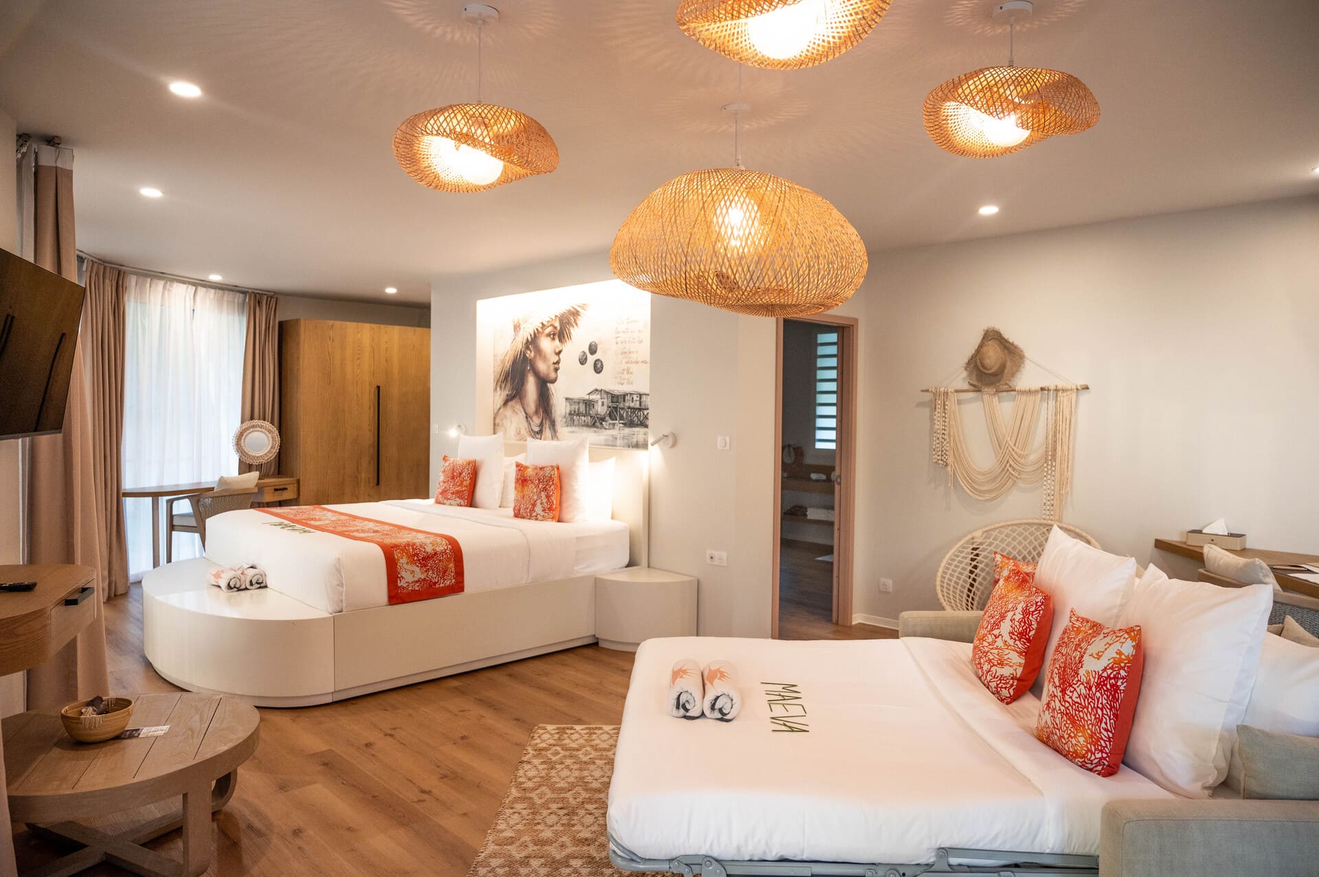 Inside the Apatoa Raiateta Luxury Villas - a white, sand, and coral palette, interwoven against a backdrop of Tahitian art and decor