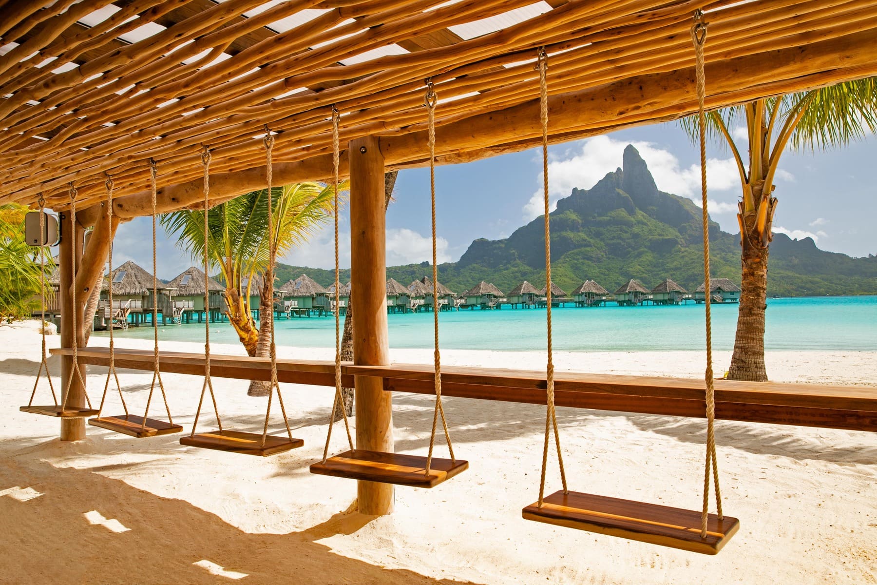 beach swings, overwater bungalows, Bora Bora, tropical vacation, luxury travel, mountain view