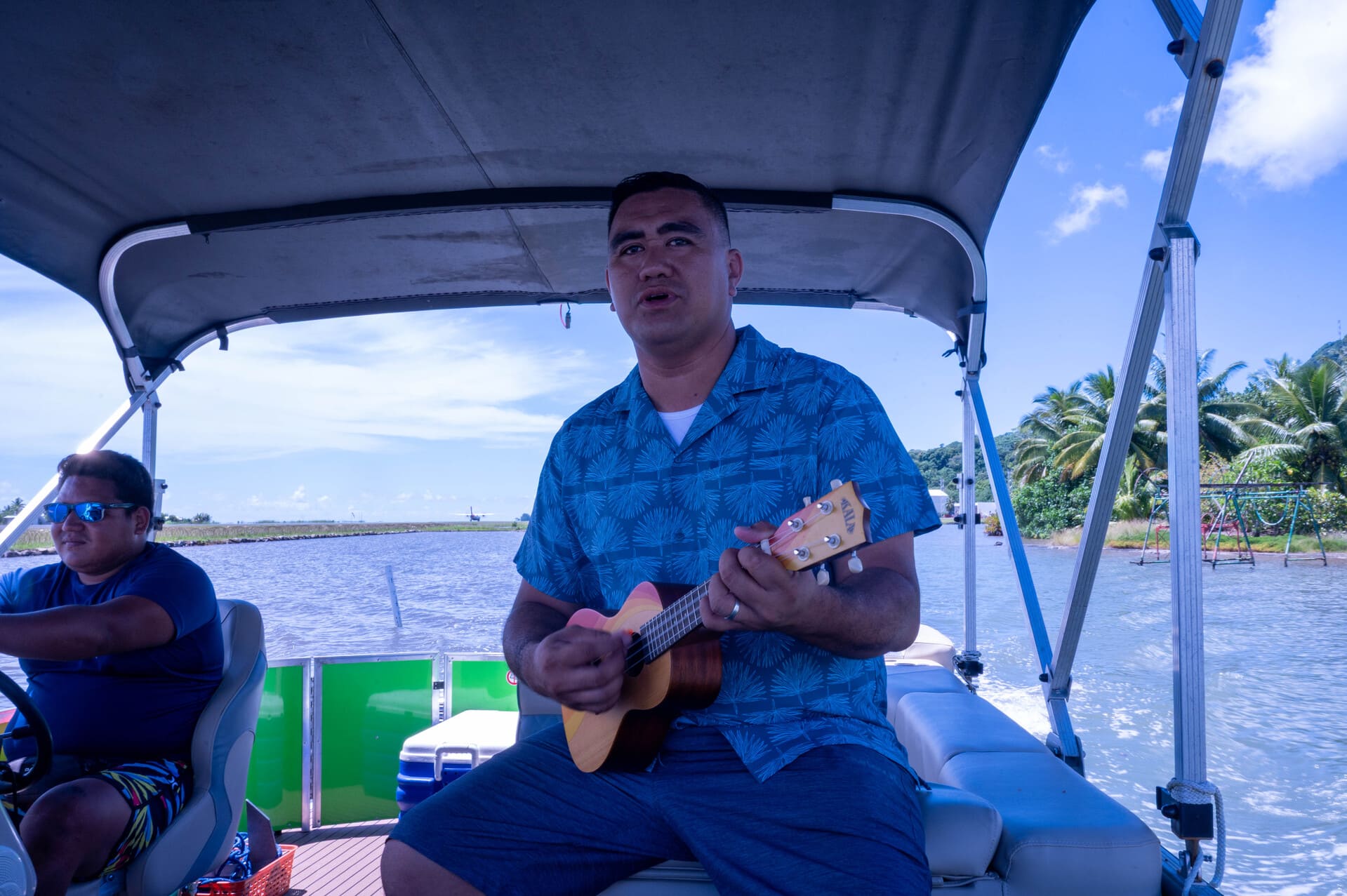 Tera, the guide from Van Bass Tours, playing his ukulele