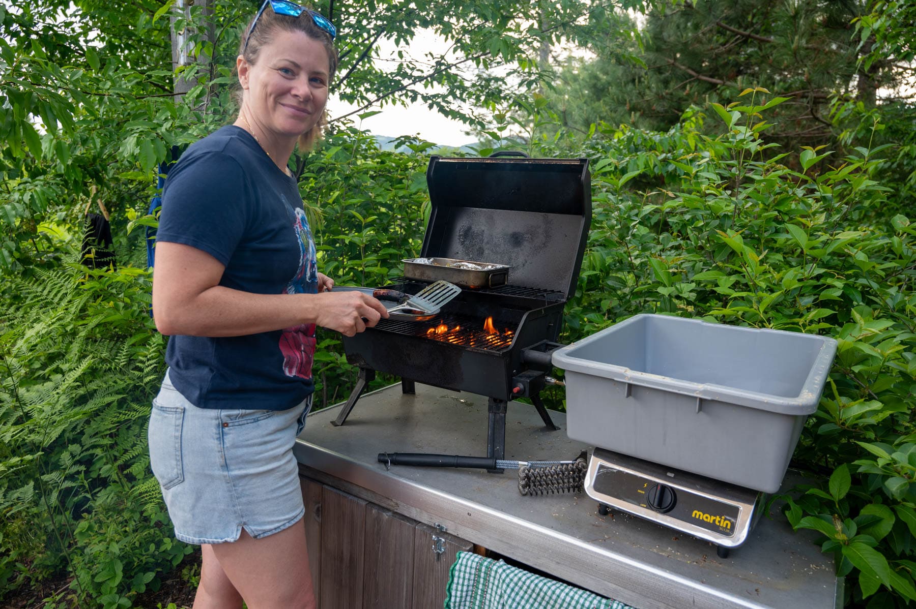 Jami Savage cooking at an outdoor BBQ