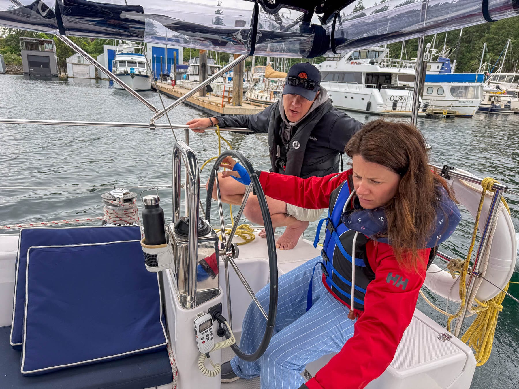 Paul Miller teaching Jami Savage to sail a boat