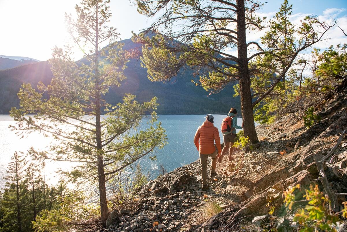 hikers on a scenic lakeside trail, Cariboo Chilcotin Coast, British Columbia, Canada